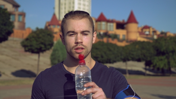 Guy Enjoy Drink After Exercises Outdoors.