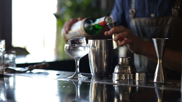 Hands Of Barman Mixing An Alcoholic Cocktail And Add Ingredients