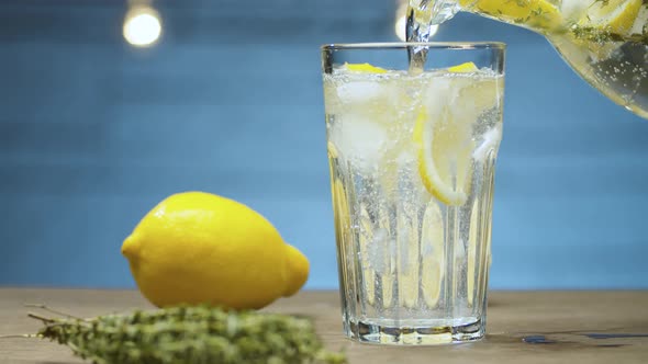 Lemonade pouring into a glass