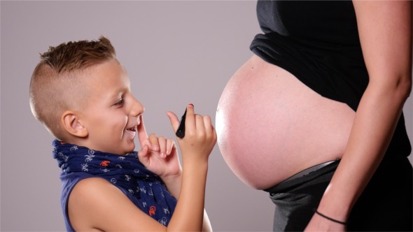 Handsome Boy Painted on the Belly of his Mother