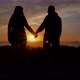 Slow Motion Couple Joining Hands Together with Sunlight in Background - VideoHive Item for Sale