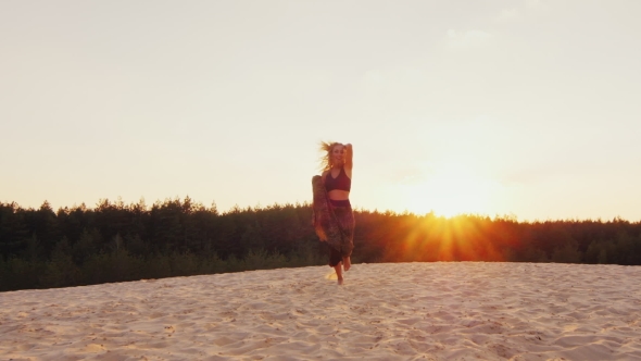 Steadicam  Shot: A Slender Woman In a Light Dress Running On a Beach At Sunset