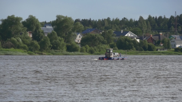 Old Ferry Crossing River With a Car