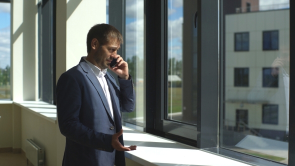 Young Successful Businessman Arguing On The Phone