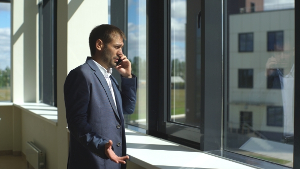 Young Successful Businessman Arguing On The Phone