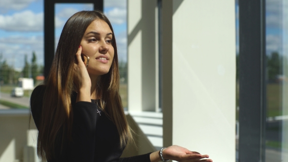 Beautiful Brunette Businesswoman Arguing On The Phone