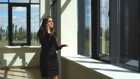 Beautiful Brunette Businesswoman Arguing On The Phone