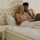 Couple Lying Bed Using Laptop Computer, Mix Race Man Woman Smile Morning Bedroom - VideoHive Item for Sale