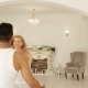 Young Happy Couple Embrace Woman Run And Jump Over Man Hug Spin Around Modern Home Bedroom Circling - VideoHive Item for Sale