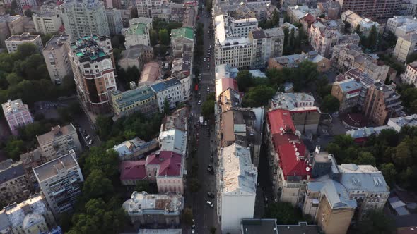 Aerial view of a beautiful and cozy evening city with narrow streets