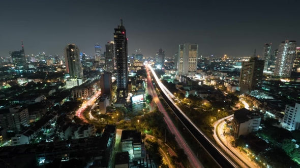 Shot Of Night Life In The Big City, Lighted Skyscraper, Traffic, Intersection, Bangkok, Thailand