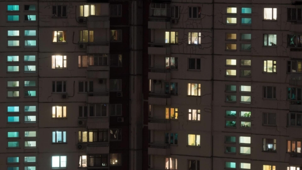Buildings And Lighted Windows At Night