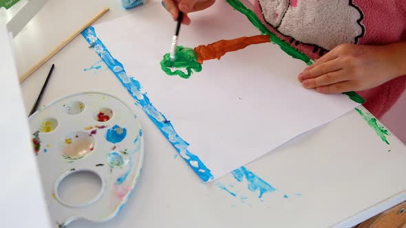 Child Painting a Picture