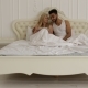 Couple Lying Bed Using Tablet Computer, Mix Race Man Woman Smile Morning Bedroom - VideoHive Item for Sale