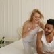 Couple Lying Bed Using Smart Phone Mix Race Man Woman Having Fun Playing Embrace Smile Morning - VideoHive Item for Sale