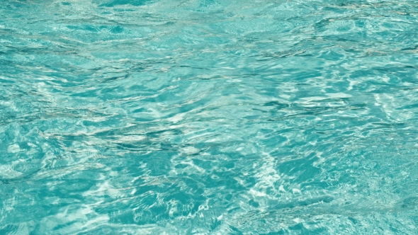 Blue Water Rippled Background In Swimming Pool. .