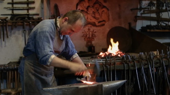 Artisan Blacksmith Working In The Forge