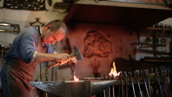 Blacksmith Forges On The Anvil, The Hot Metal