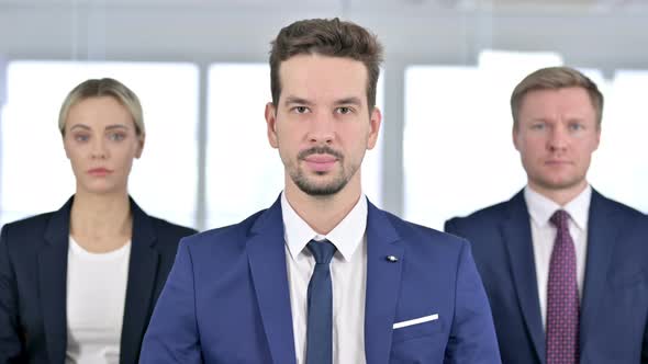 Portrait of Business Team Looking at the Camera in Office