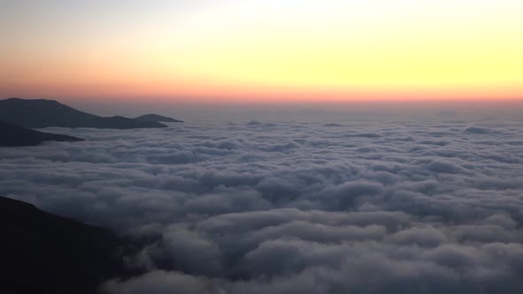 Twilight Before Sunrise Over the Clouds Landscape From Mountain Peak