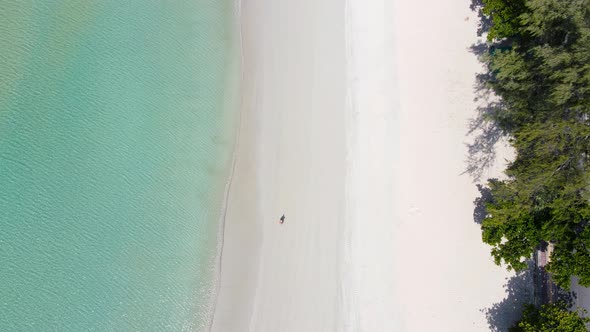 Phuket Thailand beach Aerial view top down of beach sand and seawater in sunny day.