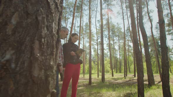 Backpackers on Hike Using Gps Orientation App Online on Tablet Pc