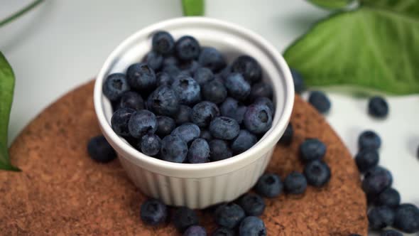 Blueberries Lying on the Table and in a White Bowl. View From the Top