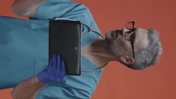 Male Doctor Using a Tablet