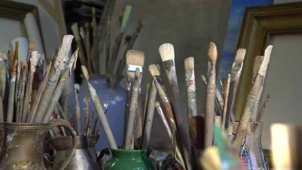 Artist's art tools in the art studio. Oil painting in creative workroom