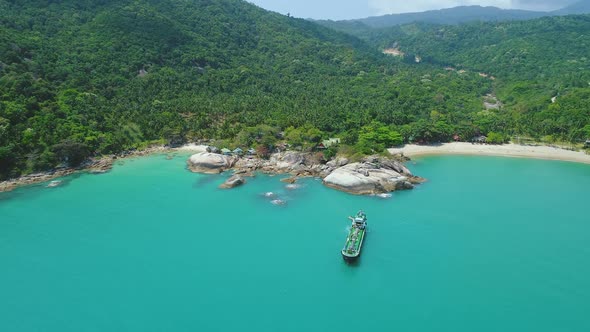 Thailand's Ocean Coast Aerial Ship Near Huge Boulder By White Sandy Haad Thong Reng Beach