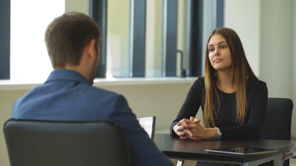 Woman Answers Questions Of The Employer At The Interview