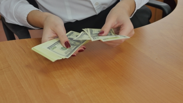 The Girl In The Office Counting Money