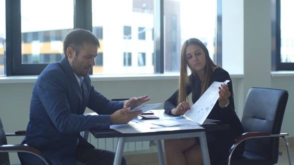 Young Businesswoman Shows The Charts To My Colleague