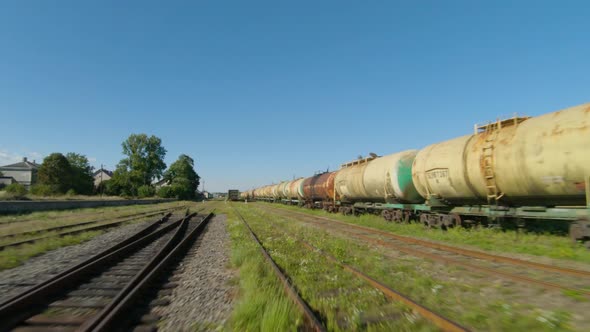 Fast Flight Along Freight Carriages.