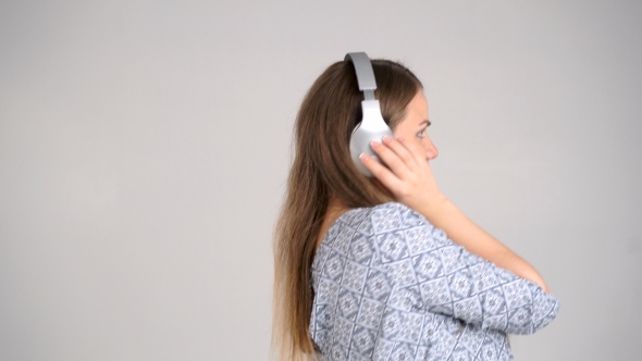 Woman With Headphones Listen To The Music