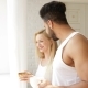 Couple Drink Coffee Morning Near Window Mix Race Man Woman Smile - VideoHive Item for Sale