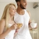 Couple Drink Coffee Morning Near Window Mix Race Man Woman Smile - VideoHive Item for Sale