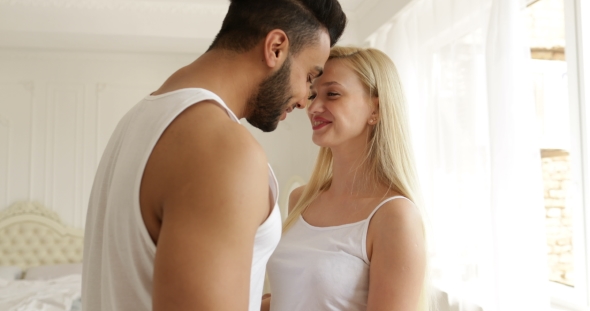 Couple Love Embrace Smile Standing Face to Face Mix Race Man Woman Hug Morning Bedroom