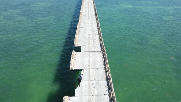 Closeup aerial journey down the Old Bahia Honda Railway Bridge in the Florida Keys, Florida, USA.  L