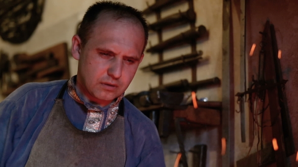 Blacksmith Working At The Furnace