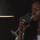 Young Beautiful African American Female Fashion Model Holding Wineglass In Her Hand And Drink From - VideoHive Item for Sale