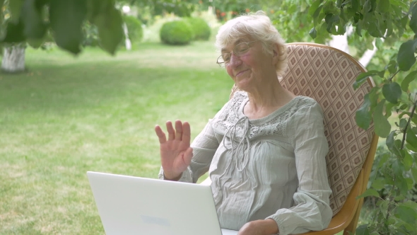 Woman Waving In Laptop Camera.