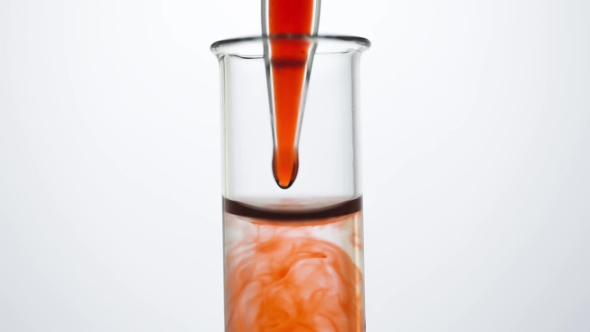 A Pipette Drips Blood Into a Test Tube