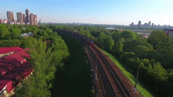 Moving Suburban Electric Train on the Bridge Near the Junction