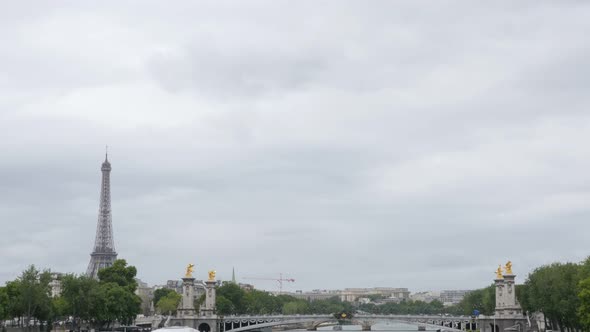 Beautiful Paris scenery with river Seine Eiffel tower and Alexandre III bridge 4K 2160p UltraHD tilt