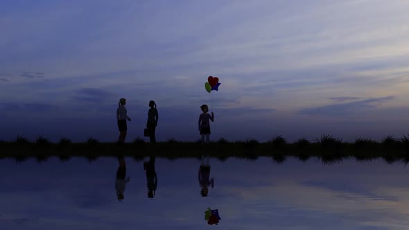 The Child Holding Balloons By The River