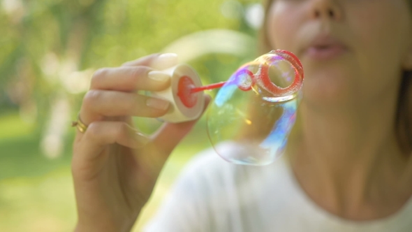 : The Woman Blows The Bubbles