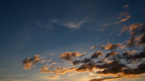 Fluffy Clouds Over Blue Sky