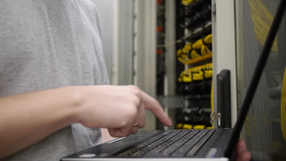 IT Engineer Checks The Server Rack