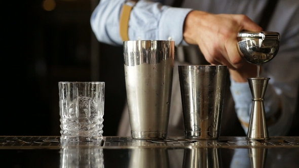 Bartender Extrudes Juice For a Cocktail